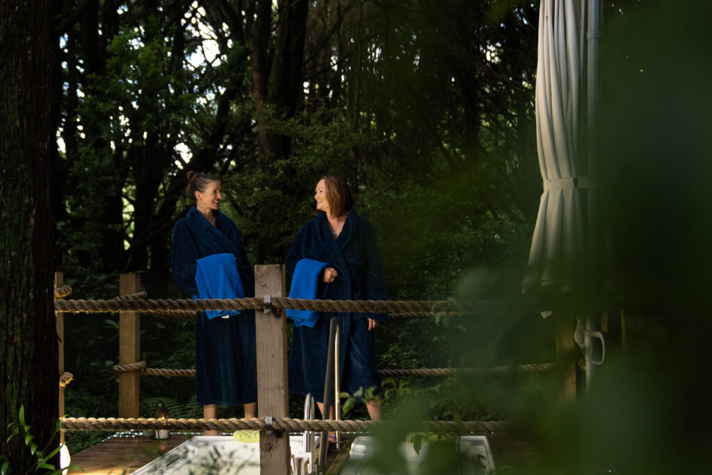 two friends getting ready for a outdoor bath in invercargill